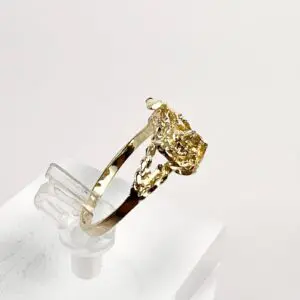 Gold ring with a yellow gemstone.