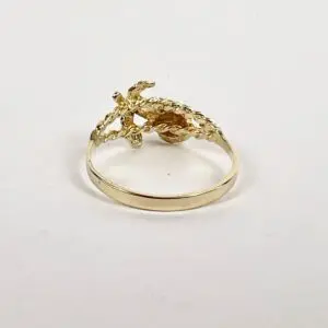 Gold ring with crocodile design.