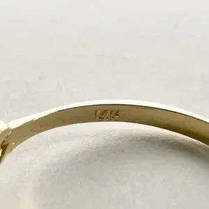 Gold ring with "14K" hallmark stamp.