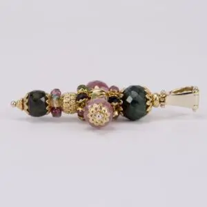 Multicolored beaded pendant with gold accents.