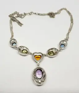 Silver necklace with colorful gemstone pendants.