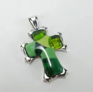 Green glass and silver cross pendant.