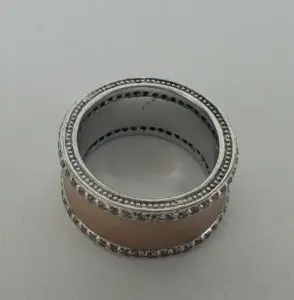 Silver and rose gold ring with diamonds.