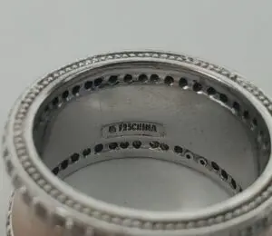 Silver ring with "925 China" engraving inside.