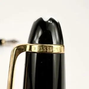Black and gold fountain pen close-up.