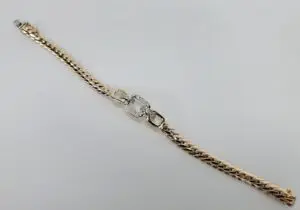 Gold bracelet with diamond centerpiece.