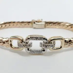 Gold and silver bracelet with linked design.