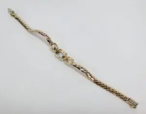 Gold bracelet with interlocking links design.