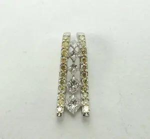 Diamond-studded earring with yellow accents.