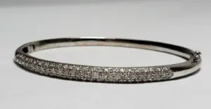 Silver bracelet with sparkling embedded stones.