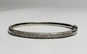 Silver bracelet with diamond accents.