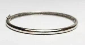Silver bangle bracelet on white background.