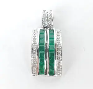 Silver pendant with green gemstones and diamonds.