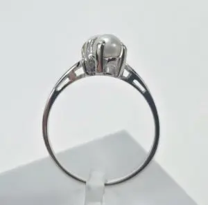 Silver ring with a single pearl.