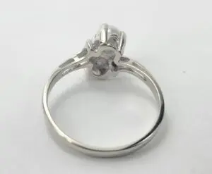 Silver ring with a raised setting.