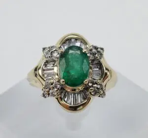 Gold ring with emerald and diamonds.