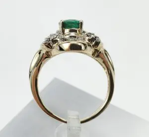 Gold ring with emerald and diamonds.