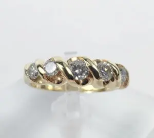 Gold ring with embedded sparkling diamonds.