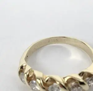Gold ring with diamonds, engraved "14K".