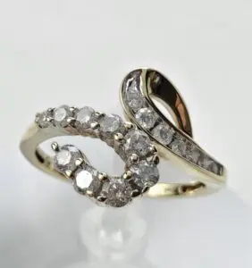 Gold ring with intertwined diamond design.
