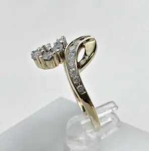 Gold ring with diamonds on display.