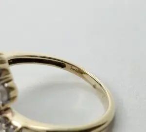 Gold ring with visible hallmark inscription.
