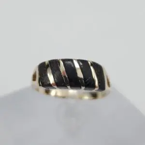 Gold ring with black striped design.