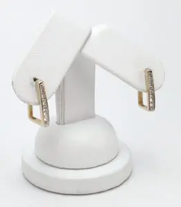 Gold and diamond hoop earrings display.