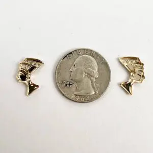 Gold earrings and a quarter coin.