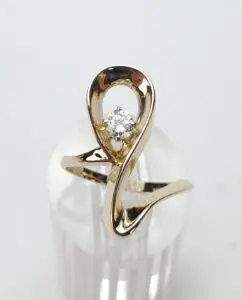 Gold ring with a single diamond stone.