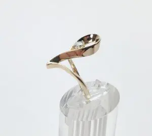 Gold ring with unique twisted design.