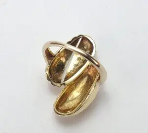 Gold ring with an abstract design.