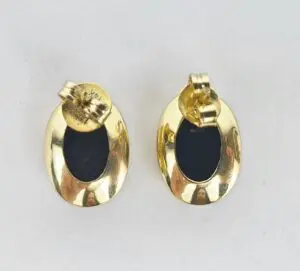 Gold oval earrings with black centers.