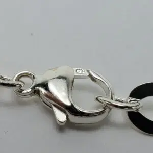 Silver lobster clasp with stamped "925" mark.