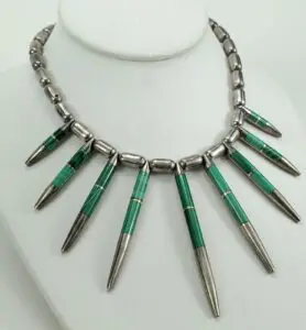 Silver and green beaded spike necklace.
