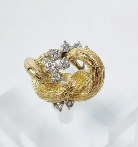 Gold ring with diamond cluster design.