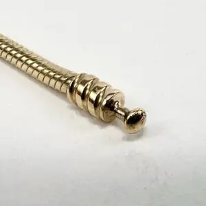Gold screw on a white background.