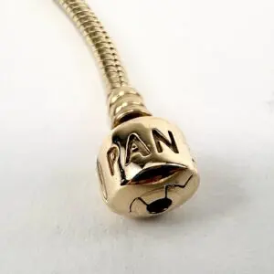 Gold microphone with "PAN" engraving.