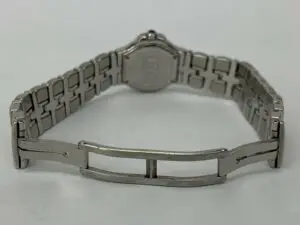 Silver watch bracelet with open clasp.
