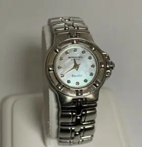 Silver wristwatch with pearl face display.