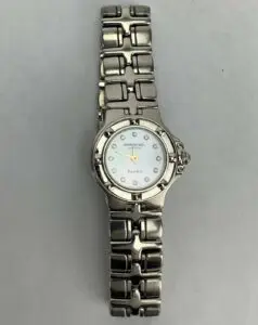 Silver wristwatch with metal bracelet band.