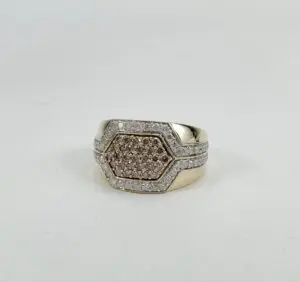 Gold ring with hexagonal diamond setting.