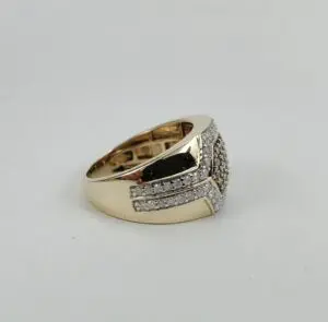 Gold ring with diamond accents on display.