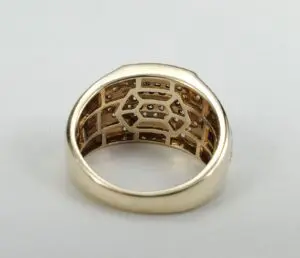 Gold ring with intricate inner design.
