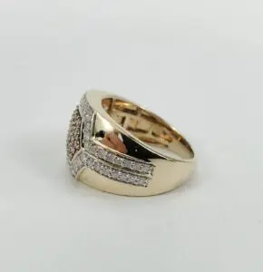 Gold ring with diamond accents on side.