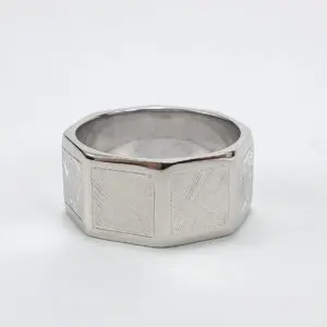 Silver geometric band with textured design.