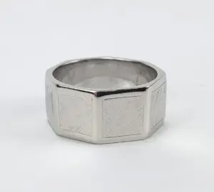 Silver octagonal ring with textured surface.