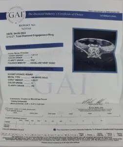 Diamond certificate with engagement ring image.