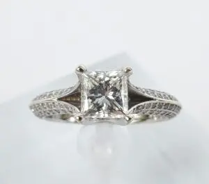 Princess-cut diamond engagement ring on display.