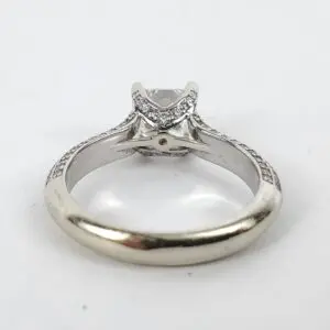 Silver engagement ring with central diamond.